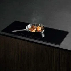 AEG IKK93431FB 91cm Induction Hob - Black 5 AEG IKK93431FB 91cm Induction Hob - Black -Kitchen Series Shop aeg ikk93431fb close up cooking on counter top