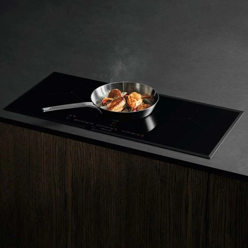 AEG IKK93431FB 91cm Induction Hob - Black AEG IKK93431FB 91cm Induction Hob - Black -Kitchen Series Shop aeg ikk93431fb close up cooking on counter top
