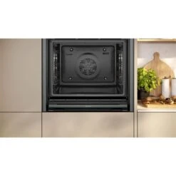 Neff N70 B54CR71G0B Bulit In Single Slide & Hide Pyrolytic Oven With Home Connect - Black With Graphite Grey Trim -Kitchen Series Shop n e neff n70 b54cr71g0b slide and hide pyrolytic oven lifestyle2